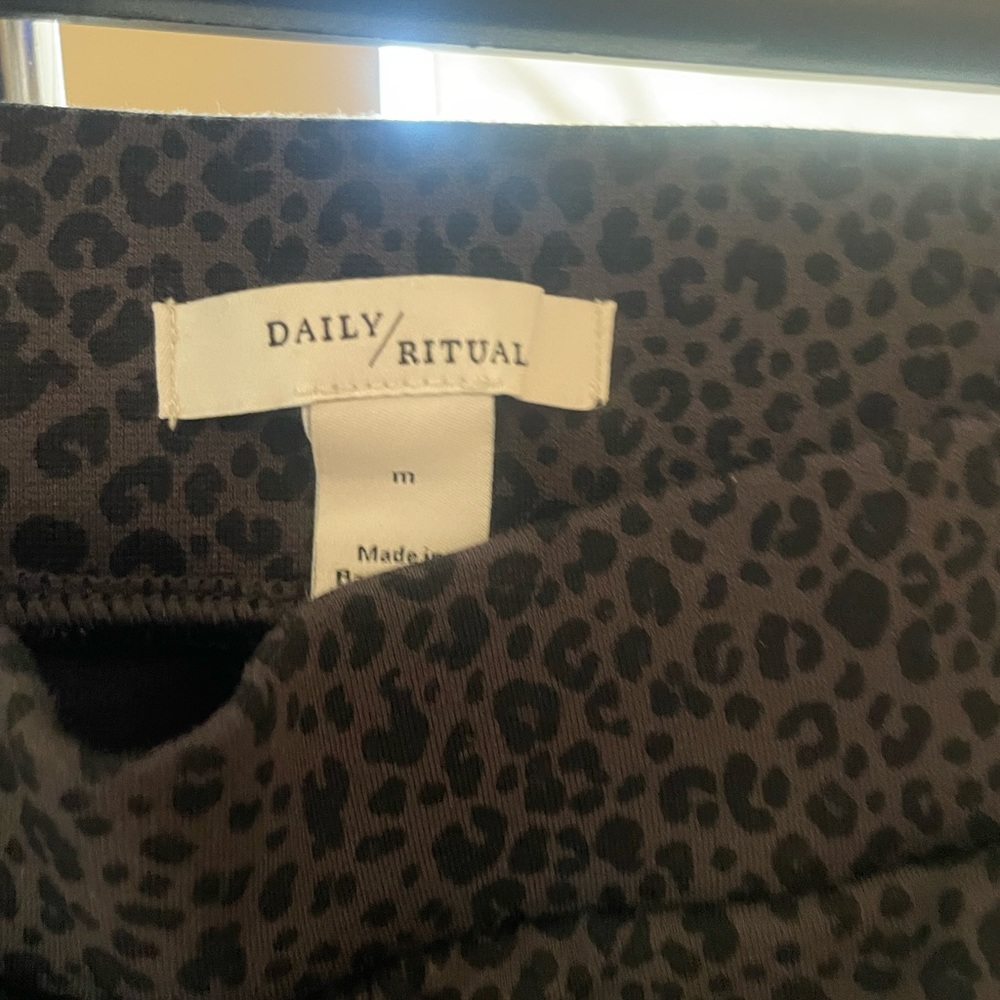 daily ritual animal print dark olive black ponte legging